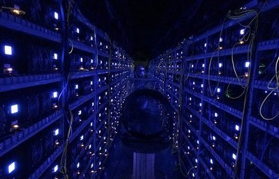 Large-scale mining farm with rows of active Ethereum and Bitcoin miners