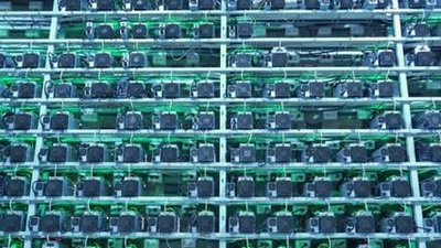 High-performance mining rigs housed in a facility powered by wind energy